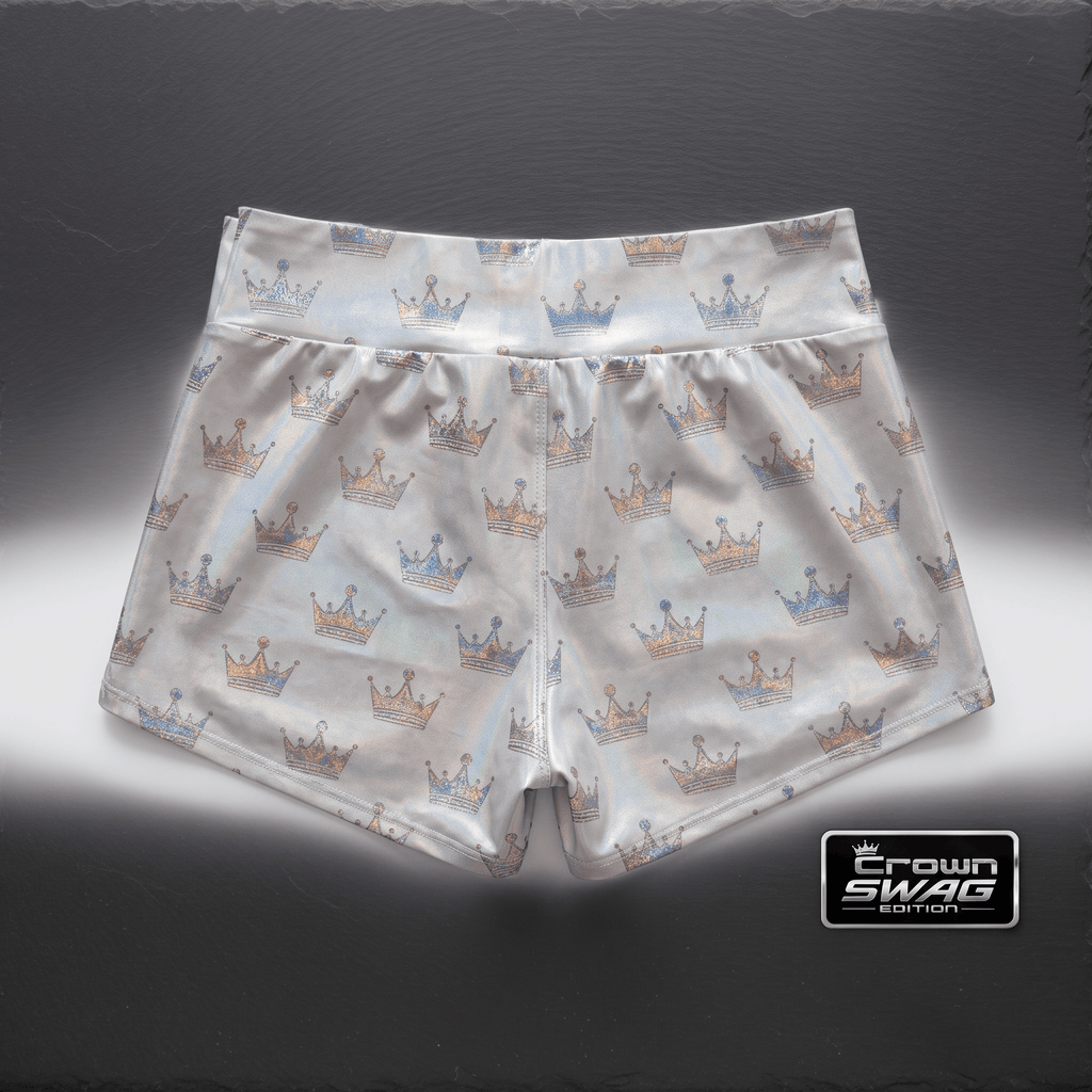 Silver athletic shorts featuring an allover metallic blue and gold crown pattern on a dark background.