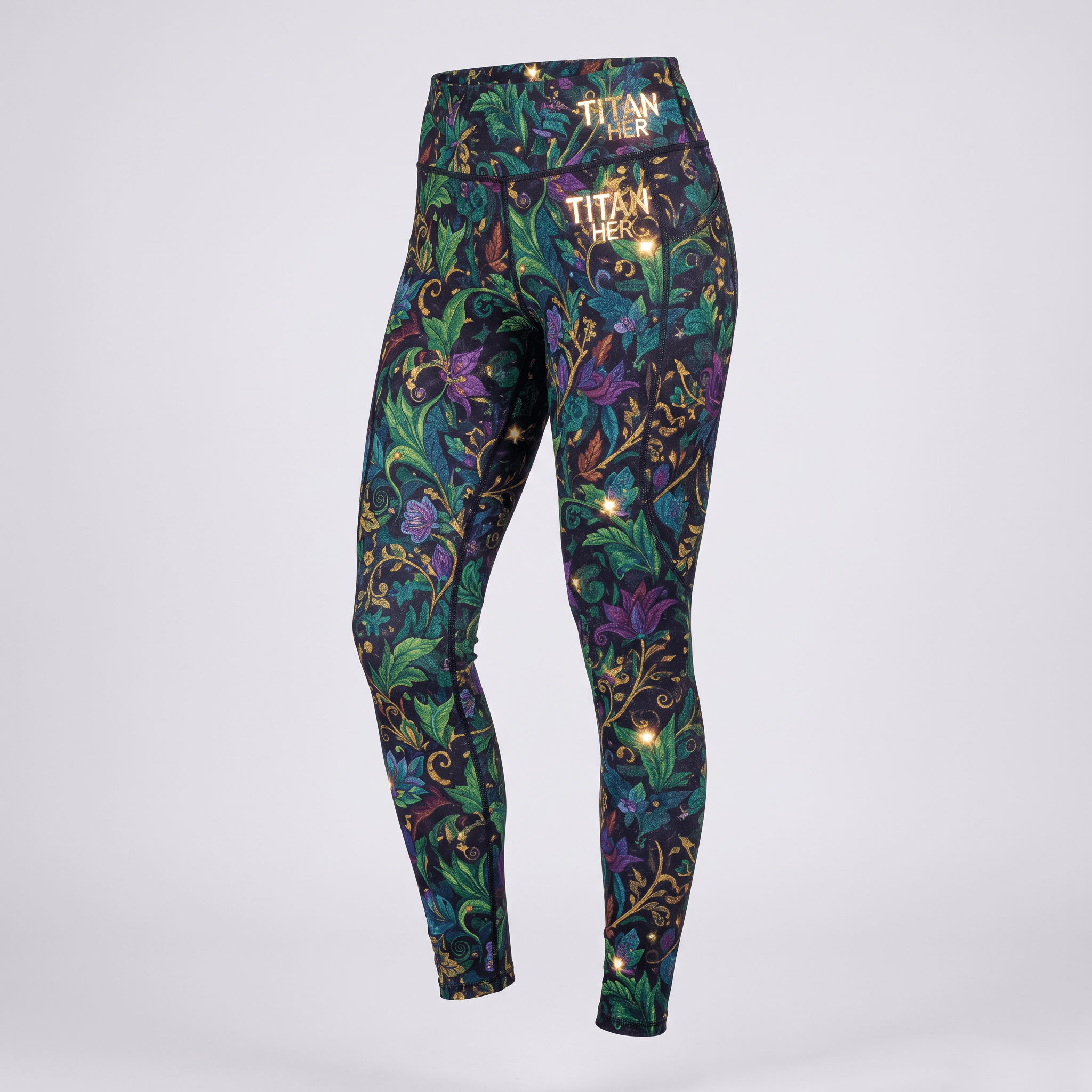 Titan Her high-waisted leggings with black, green, and purple floral pattern and gold logo print.