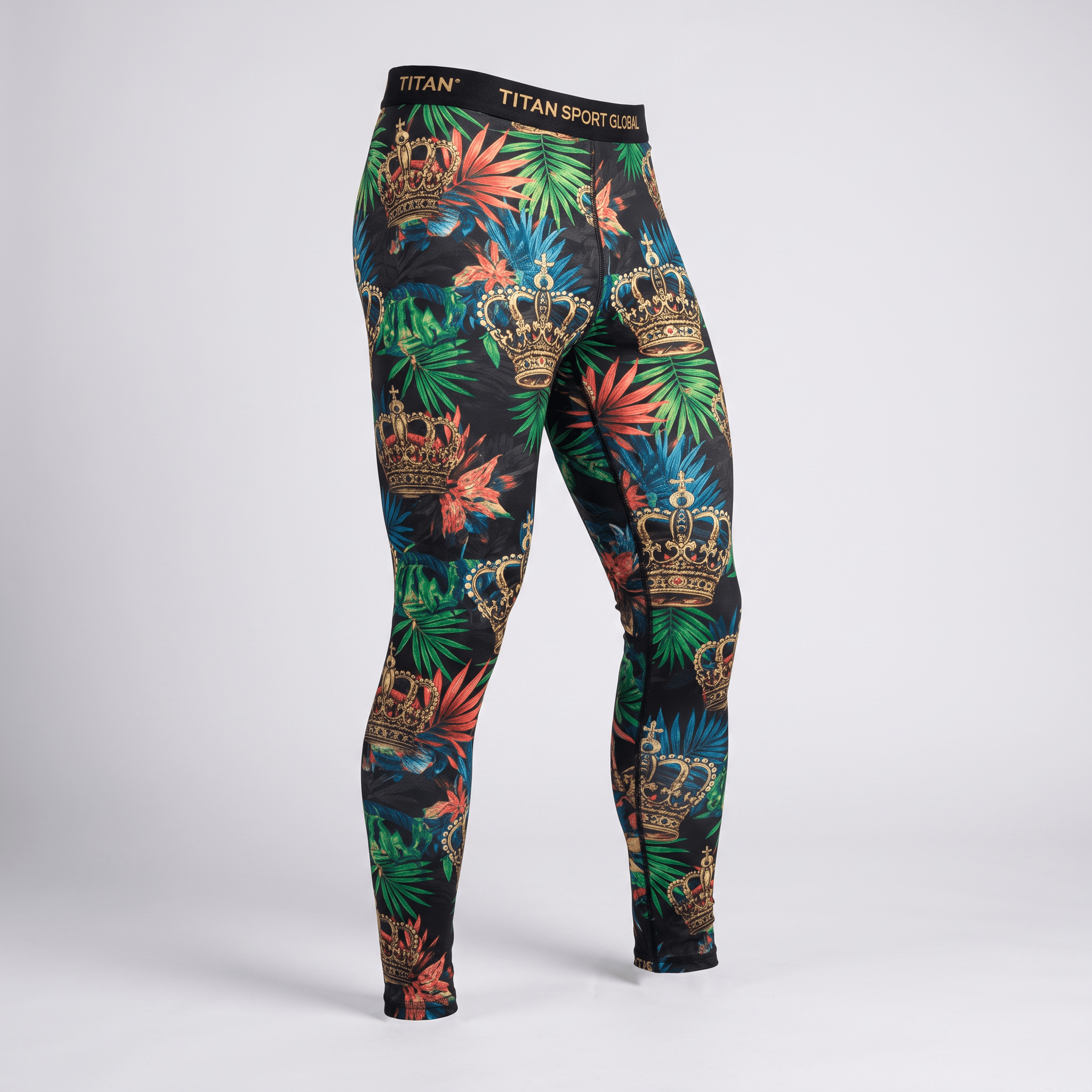 Titan Sport Global athletic leggings featuring a black base with tropical palm leaves and gold crowns.
