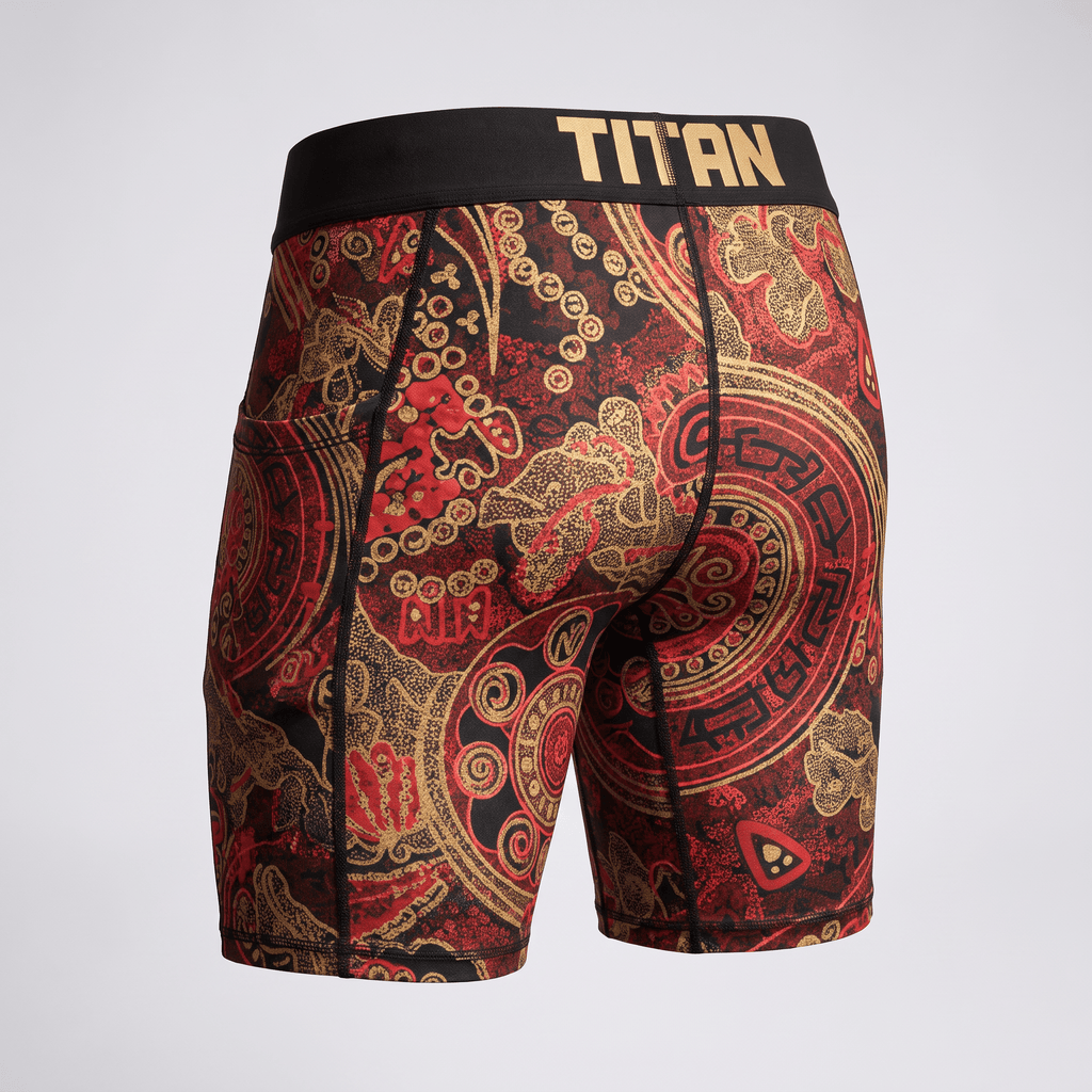 Rear view of red and gold patterned boxer briefs with a black Titan waistband.