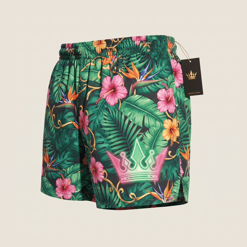 Green tropical print swim shorts featuring colorful hibiscus flowers and a glowing neon pink and green crown logo.