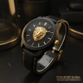 Titan Gold Lion watch with black face, 3D gold lion emblem, black leather strap, and gold stitching accents.