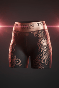 Black training shorts with metallic rose gold lion and floral print, featuring a branded TITAN sport waistband.