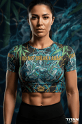 Woman wearing a cropped tee with a green dragon-goddess graphic and the text "I DO NOT BREAK I ADAPT."