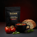 TITAN Clean Eating Protein Soup Tomato Basil — side-angle mug shot with rich red tomato basil soup, fresh basil and rustic bread