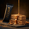 TITAN Keto Protein Bar Almond Butter Crunch — dynamic stacked bar shot with almond butter drizzle and whole roasted almonds