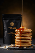 TITAN Keto Pancake Mix Almond Flour — dramatic syrup pour shot with tall golden pancake stack, maple syrup cascade and melting butter
