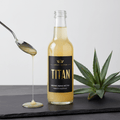 TITAN Organic Agave Nectar Light Crown Edition — premium clear glass bottle product shot
