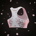 TITAN Elite Sports Bra All White — Crown Edition cherry blossom butterfly tattoo floating back-angle racerback shot