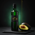 TITAN Avocado Oil Extra Virgin Cold-Pressed Crown Edition — premium dark green glass bottle product shot