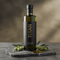 TITAN Extra Virgin Olive Oil Cold-Pressed Crown Edition — premium dark green glass bottle product shot