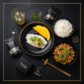TITAN Thai Steamed Ginger Fish Power Breakfast meal kit flat lay dark luxury