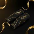 TITAN Crown Edition black compression arm sleeves with metallic gold branding and geometric gold line accents.
