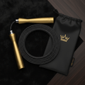 TITAN Volleyball Jump Rope Crown Edition matte black braided steel cable gold crown logo handles ball-bearing carry pouch flat lay