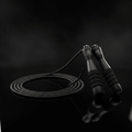 TITAN Speed Cable Skipping Rope Elite — matte black with gold crown logo