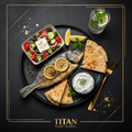TITAN Greek Lemon Herb Sea Bream Breakfast Plate flat lay dark luxury