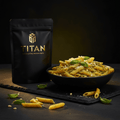 TITAN Clean Eating Protein Pasta Chickpea Penne — elegant pesto plated dish with golden chickpea penne, pine nuts and fresh basil