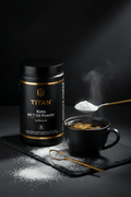 TITAN Keto MCT Oil Powder Unflavored — sleek bulletproof coffee lifestyle shot with MCT powder dissolving into steaming black coffee, creamy white swirl
