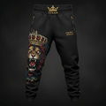 Black Titan joggers with gold zippers, "Crown Edition" text, and a vibrant crowned lion graphic on the right leg.