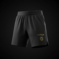 Black performance compression training shorts with a gold TITAN logo and crown shield emblem on the left leg.
