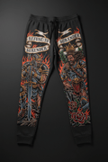 Black joggers featuring warrior tattoos, fire, roses, and the motivational "Refuse to Surrender" banner design.