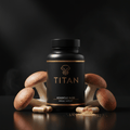 Black bottle of Titan Agaricus Bliss with gold logo, surrounded by mushrooms, capsules, and powder on black surface.