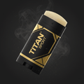 TITAN Sport anti-chafe stick in black and gold, featuring a cream balm, water droplets, and smoke on a dark background.