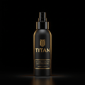 Matte black spray bottle with gold "TITAN" logo and text label on a dark background. Premium, minimalist aesthetic.