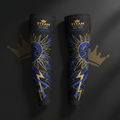 Black Titan compression arm sleeves with gold crown logo, sun graphic, and blue lightning bolt accents.