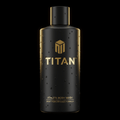 Matte black TITAN athlete body wash bottle with gold branding and water droplets against a black background.