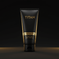 Black squeeze tube of TITAN Athlete Foot Cream with gold text and a gold band against a dark background.