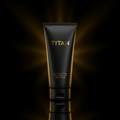Matte black tube of Titan Athlete Hand Cream with gold logo and text, centered against a dark, glowing radial light.