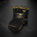 Three-pack of black TITAN athletic socks with gold logo, brand name, and detailing in a branded paper wrap.