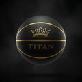Black textured TITAN basketball with gold crown logo, gold lettering, and metallic gold channels on a dark background.