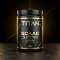 Black tub of TITAN BCAAs with gold text, 7g 2:1:1 ratio, 60 servings, lemon-lime flavor, on a dark textured surface.