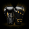 Black and gold TITAN Pro Series genuine leather boxing gloves with gold branding and stitching against black background.