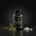 Black supplement bottle with gold Titan logo, labeled 200mg Caffeine. Flanked by coffee beans, green leaves, and pills.
