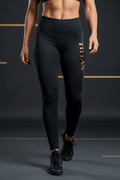 Black high-waisted compression leggings with a metallic gold vertical "TITAN" logo on the left hip.