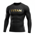 Black long-sleeve compression shirt with gold metallic TITAN logo on the chest and ventilated side panels.