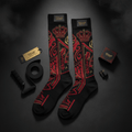 Black compression socks with red and gold regal crown and geometric patterns, featuring Titan logo branding.