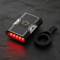 TITAN Crown Edition cycling rear light in matte black with gold logo, iridescent accents, and glowing red LEDs.