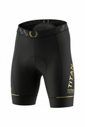 Black cycling shorts with gold Titan Sport Global branding, a laurel-patterned waistband, and reflective leg accents.