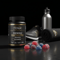 TITAN electrolyte gummies bottle, gym shoe, water bottle, and black towel on a dark surface with red and blue gummies.