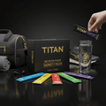 TITAN 30-pack variety box with colorful electrolyte stick packs, water bottle, gym bag, and athletic gear on black.