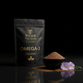 Black pouch of Titan Ground Organic Flax Seeds with gold text, next to a bowl of ground seeds and purple flax flowers.