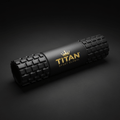 Black 18-inch Titan Sport Global foam roller with textured grid pattern and gold logo on a dark background.