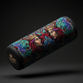 TITAN foot massage roller with vibrant, ornate artwork of crowned women and mythical creatures on a black background.