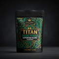 TITAN Greens Powder pouch in black with ornate green tropical foliage, gold crown logo, and bold white text.
