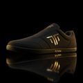 TITAN GripMax deadlift slipper in matte black with gold logo, minimalist sole, and reflective black surface.