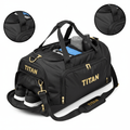 Large black TITAN gym duffel bag with gold logo and zippers, separate shoe compartment, and padded shoulder strap.